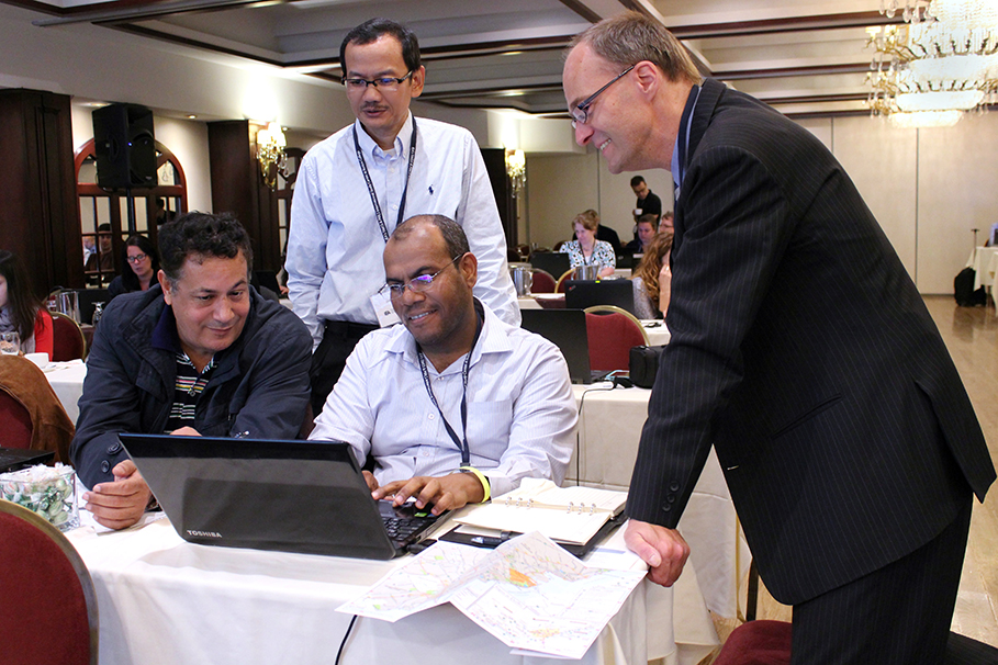 Said Bouderga of Morocco, Ir Nizam of Indonesia, and Ali Juma Ali AlRasbi of Oman consulted with Oliver Neuschmidt of the IEA on the International Database Analyzer.